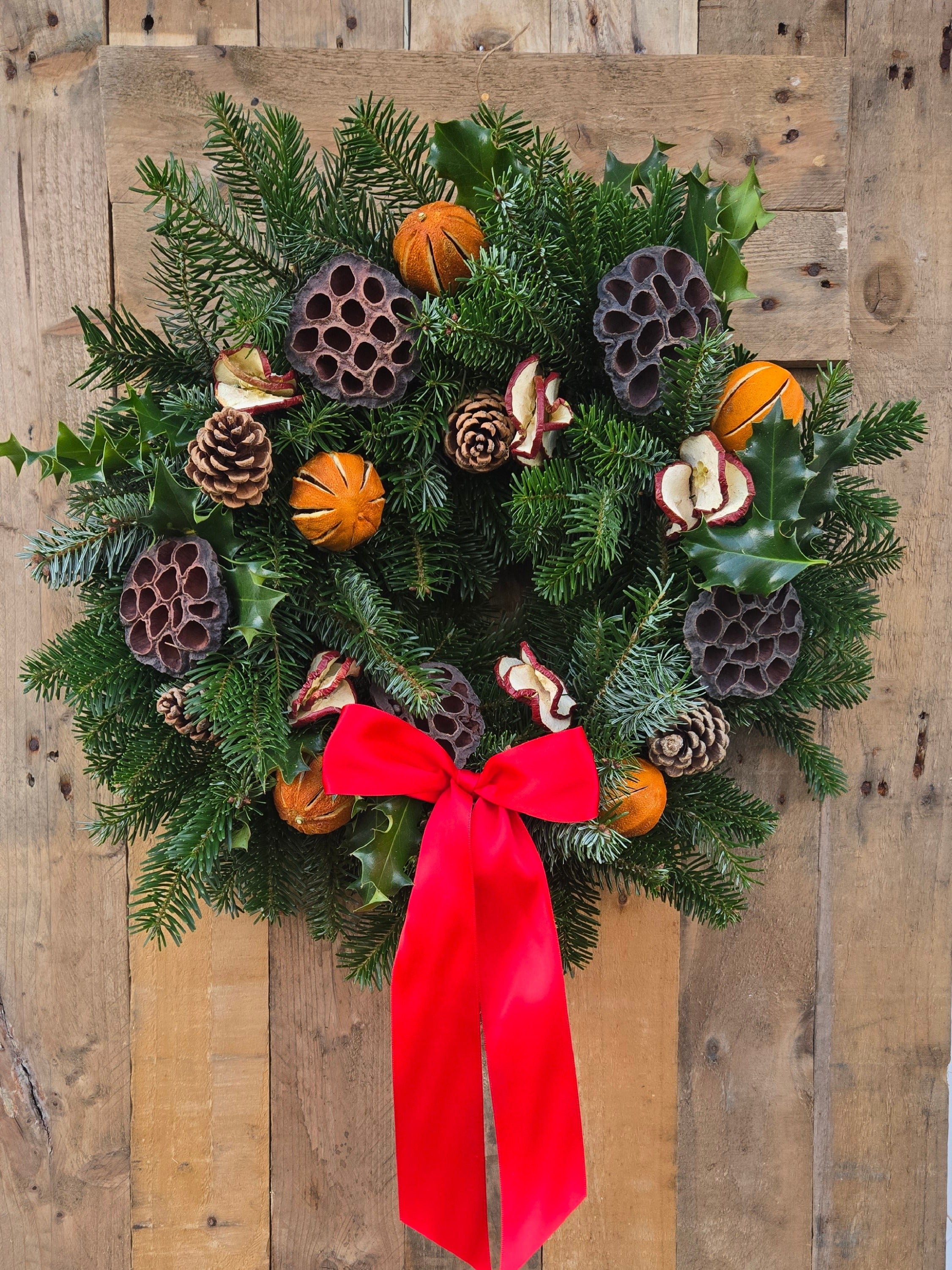 Traditional Classic Christmas Luxury Wreath featuring dried oranges, lotus heads, dried apple slices and vibrant red ribbon £85